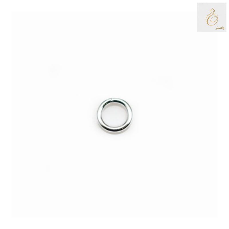 Close-up view of 925 sterling silver closed jump rings showing bright silver finish and precise 5x0.8mm dimensions