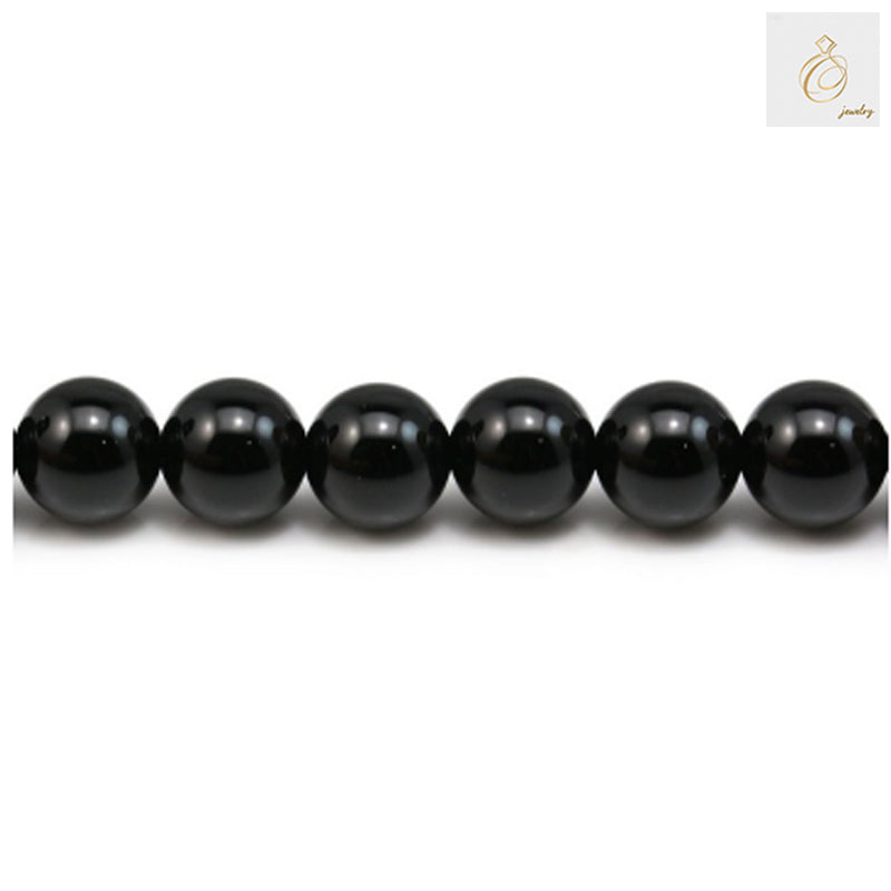 Glossy black agate round beads 8mm diameter arranged in a strand, perfect for jewelry making and craft projects