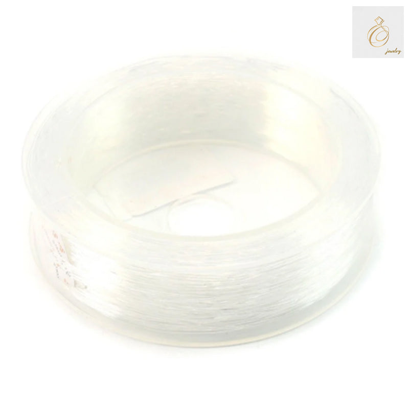 Premium 1.0mm elastic thread roll, 28 meters length for jewelry making and crafts"
"Clear elastic beading thread 1.0mm diameter on white background"
"High-quality elastic cord for bracelet and necklace making, 28m roll