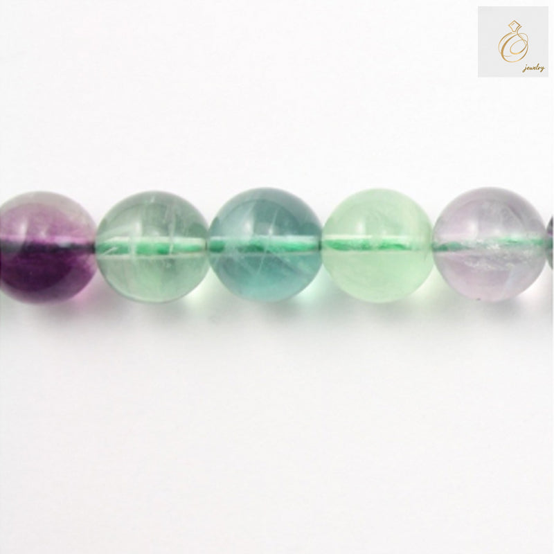 Natural fluorite round beads 8mm on white background showing translucent purple and green colors"
"Close-up view of 8mm fluorite gemstone beads displaying natural color variations"
"Full strand of natural fluorite round beads 39cm length for jewelry making