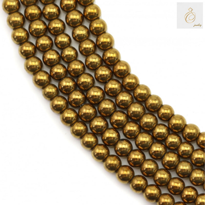 Close-up view of golden hematite round beads showing lustrous metallic surface and uniform 2mm size