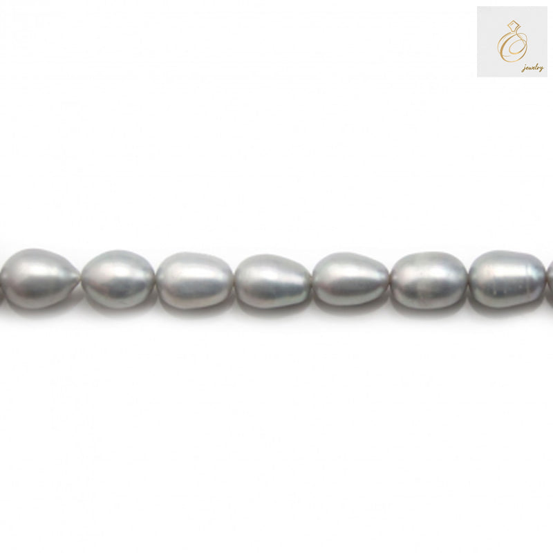 Premium grey oval freshwater pearls on white background