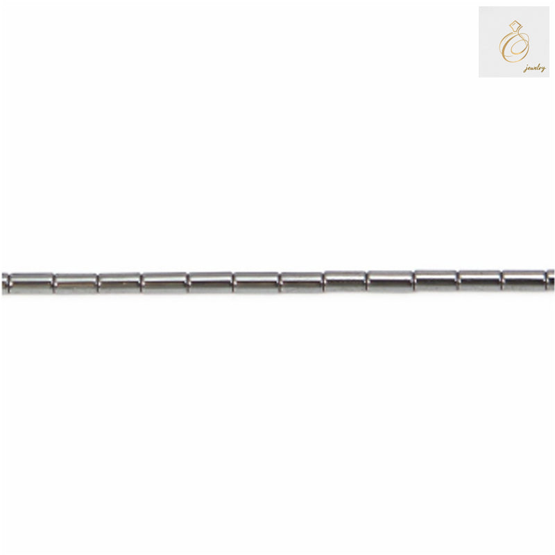 Natural hematite cylinder beads 2x4mm with metallic luster, arranged on strand for jewelry making