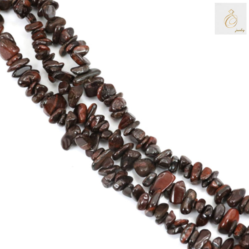 Natural tiger's eye chip beads strand showing golden-brown gemstone pieces with characteristic chatoyancy and banded patterns