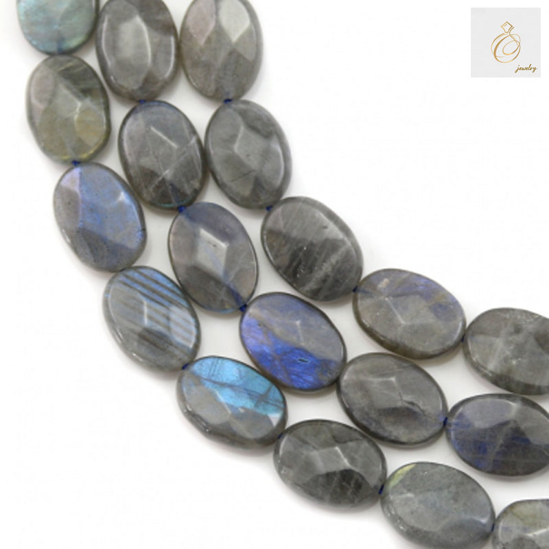 Natural labradorite beads strand with faceted oval shape"
"Close-up of labradorite gemstone beads showing iridescent flash