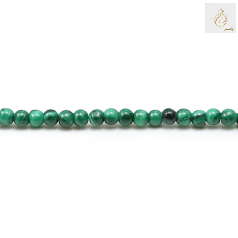 Natural malachite round beads 3mm diameter strand for jewelry making"
"Green malachite gemstone beads 132 pieces per strand"
"Close-up of natural malachite beads showing green patterns and round shape