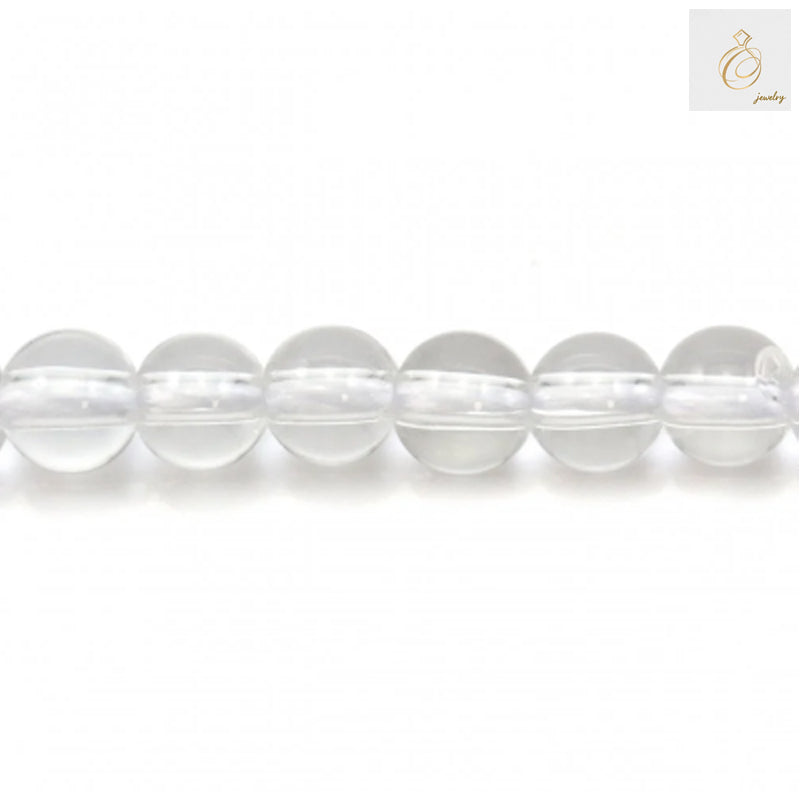 Close-up view of natural rock crystal beads showing clarity and round shape, 4mm diameter perfect for DIY jewelry projects