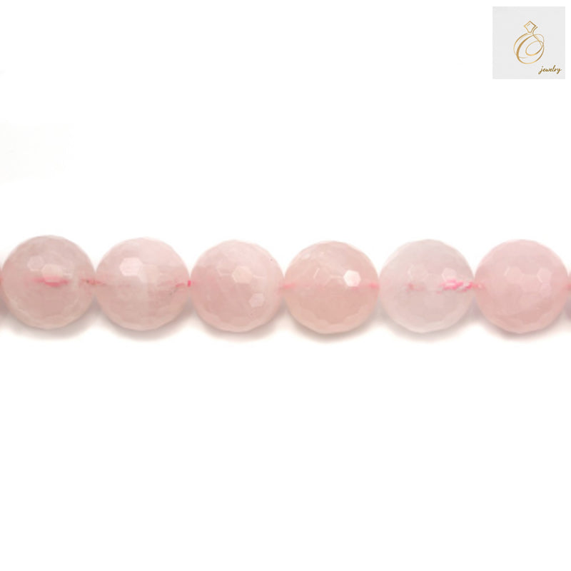 Close-up view of natural rose quartz beads strand displaying the translucent pink color and faceted surface detail
