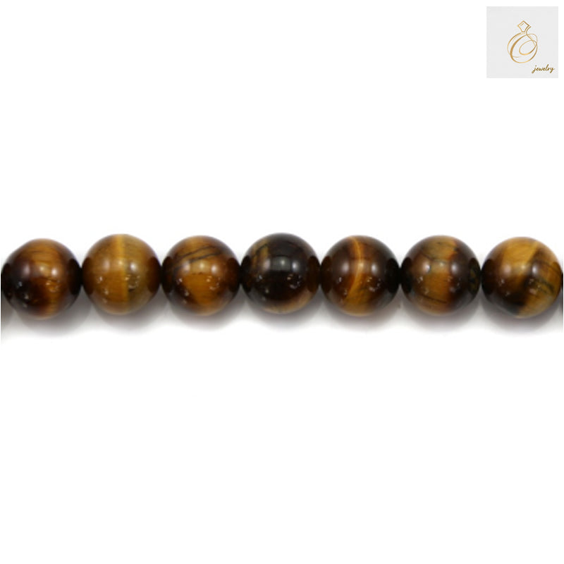 Close-up view of natural yellow tiger's eye beads showing golden striped pattern and smooth polished surface, 12mm round gemstone beads