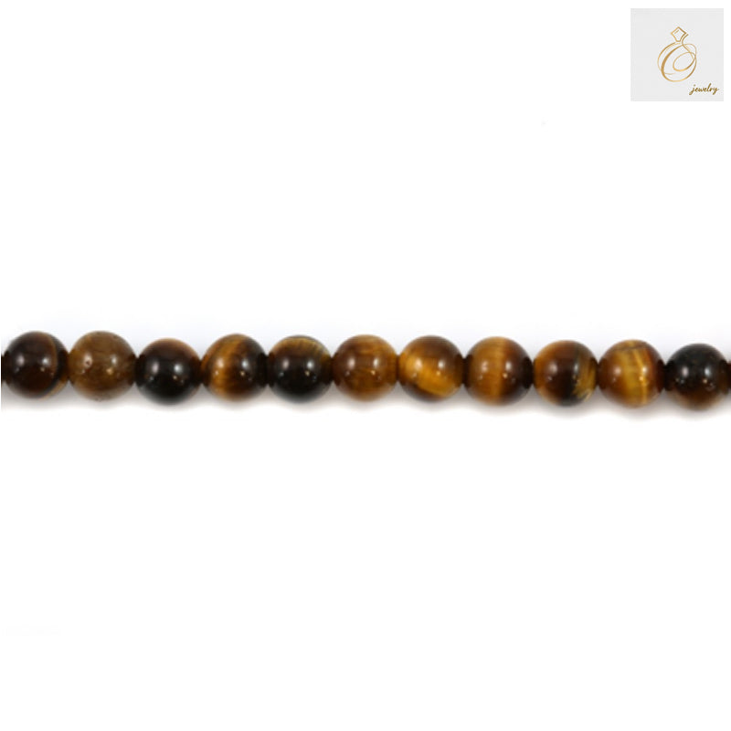 Close-up view of natural yellow tiger's eye round beads showing golden bands and smooth finish, 6mm diameter with 1.2mm holes