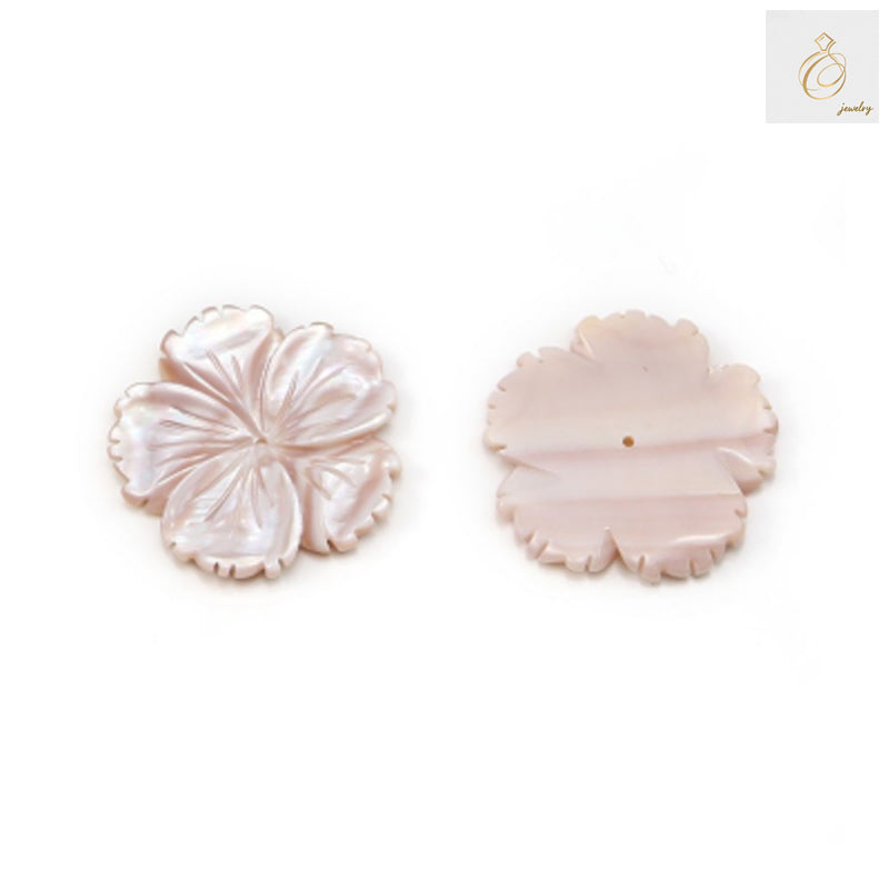 Close-up view of pink mother-of-pearl flower button displaying natural color variations and smooth polished finish, ideal for craft projects