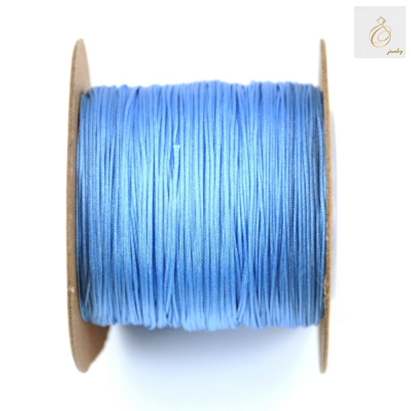 Blue polyester jewelry thread spool 0.5mm diameter for craft making"
"Premium blue polyester thread 180m spool for jewelry beading projects"
"High-quality 0.5mm blue craft thread on white spool for jewelry making