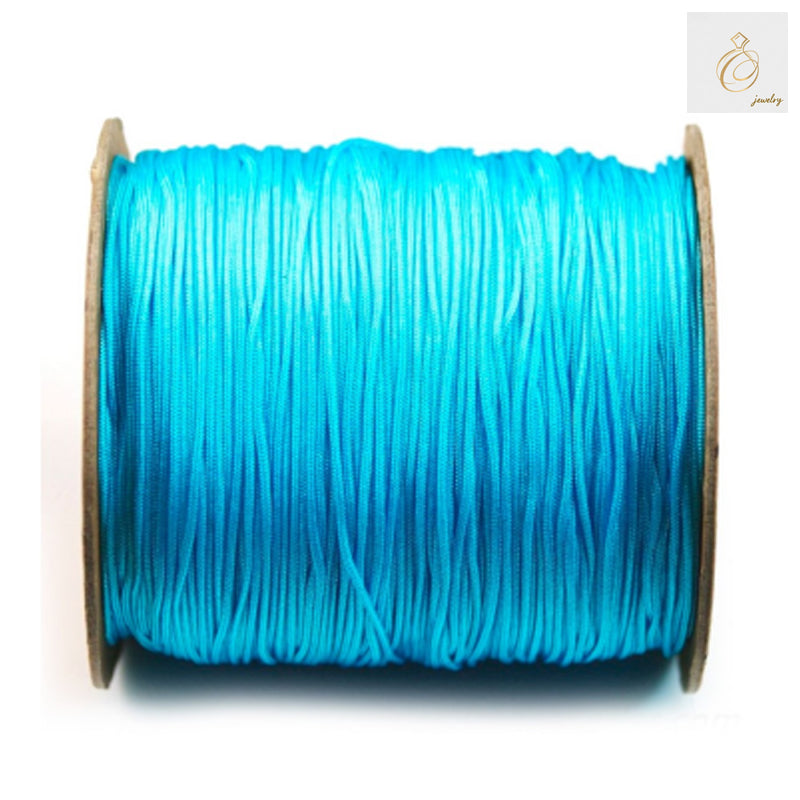 Blue polyester jewelry thread 1mm - Professional grade crafting spool 250m"
"Premium blue polyester thread for jewelry making - 1mm diameter, 250 meter spool"
"Professional blue crafting thread - 1mm polyester spool for jewelry and beading projects