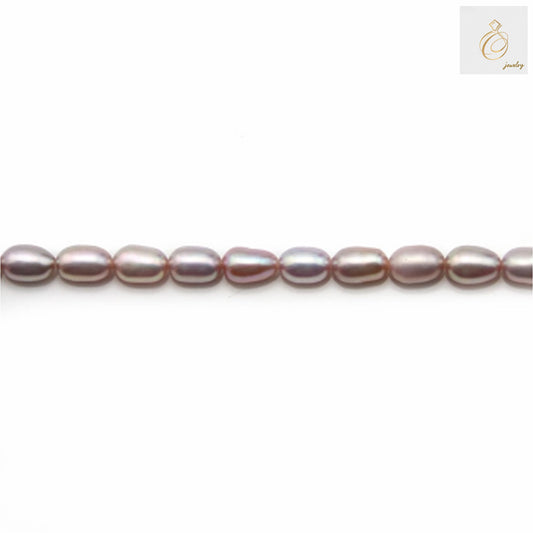 Purple freshwater cultured pearl strand with oval 4-5mm pearls"
"Close-up of lustrous purple oval freshwater pearls"
"Purple cultured pearl necklace strand for jewelry making"