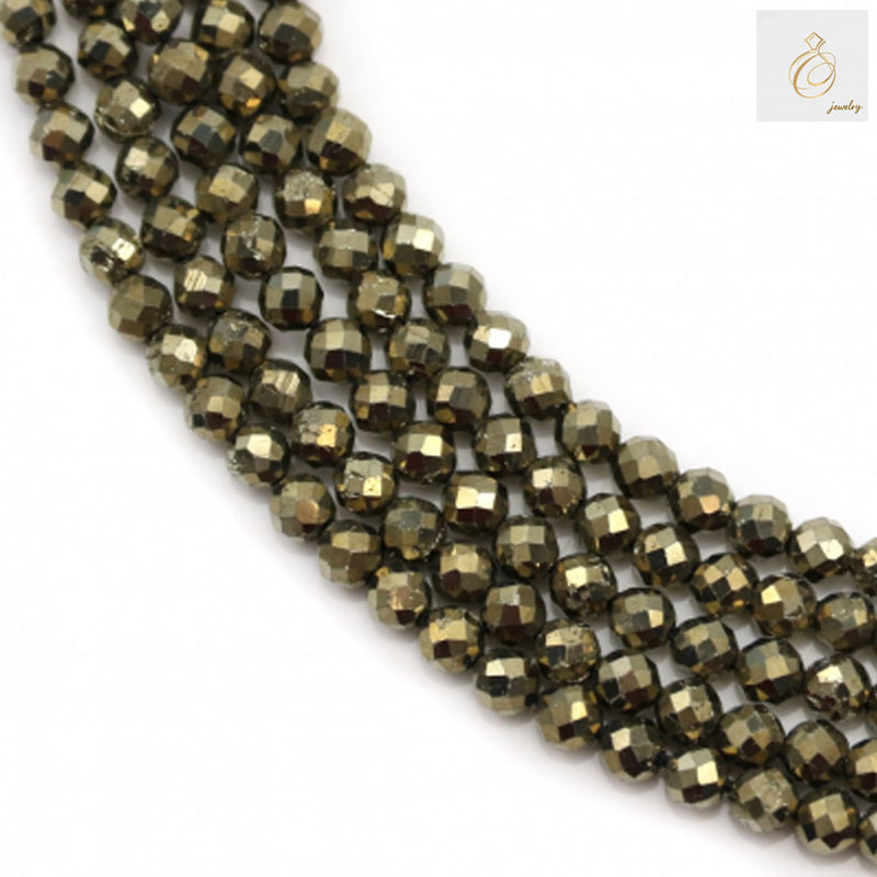 Pyrite faceted round beads 3mm diameter on strand, showing golden metallic luster and consistent sizing for jewelry making