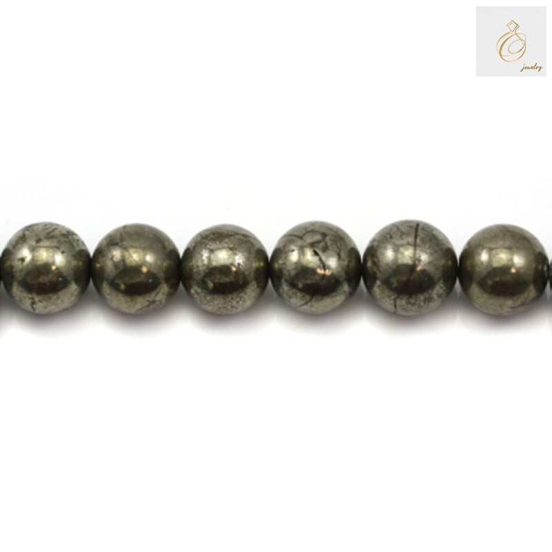 Close-up view of pyrite beads displaying the characteristic golden metallic shine and smooth polished surface finish