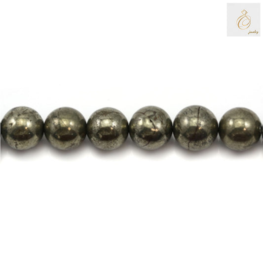 Close-up view of pyrite gemstone beads showing natural golden shine and round shape, perfect for DIY jewelry projects