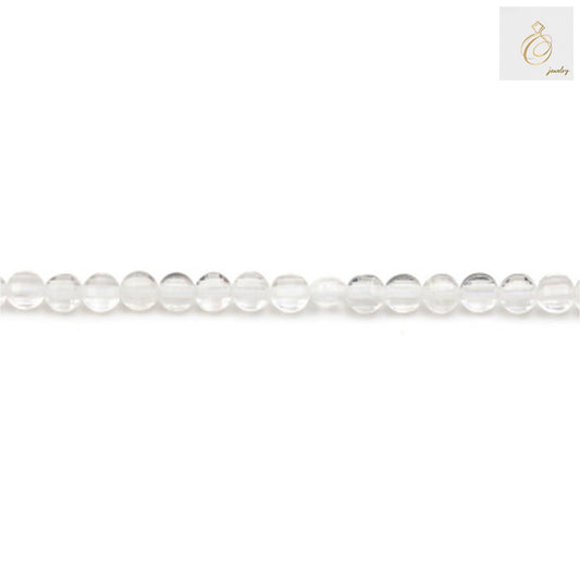 Close-up view of rock crystal faceted flat round beads showing clarity and cut quality