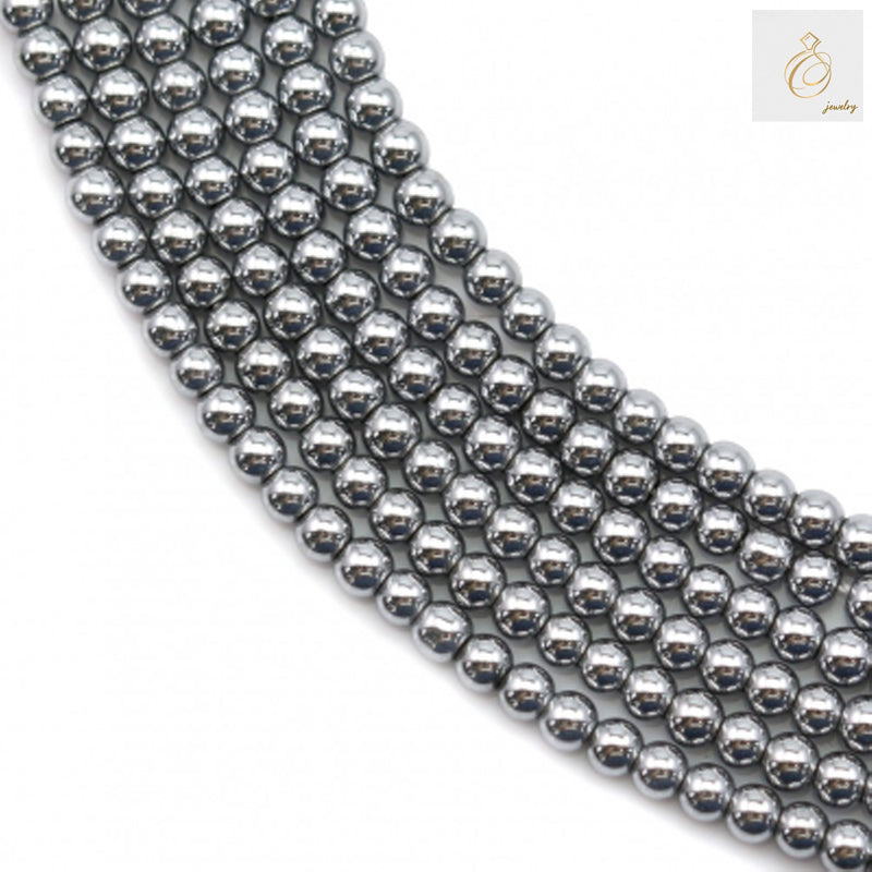 Close-up view of silver hematite beads 2mm showing uniform round shape and lustrous surface