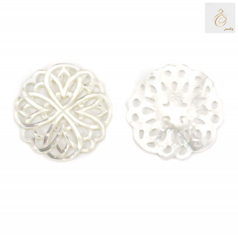 Close-up view of white mother-of-pearl shell charm showing intricate hollow floral pattern detail