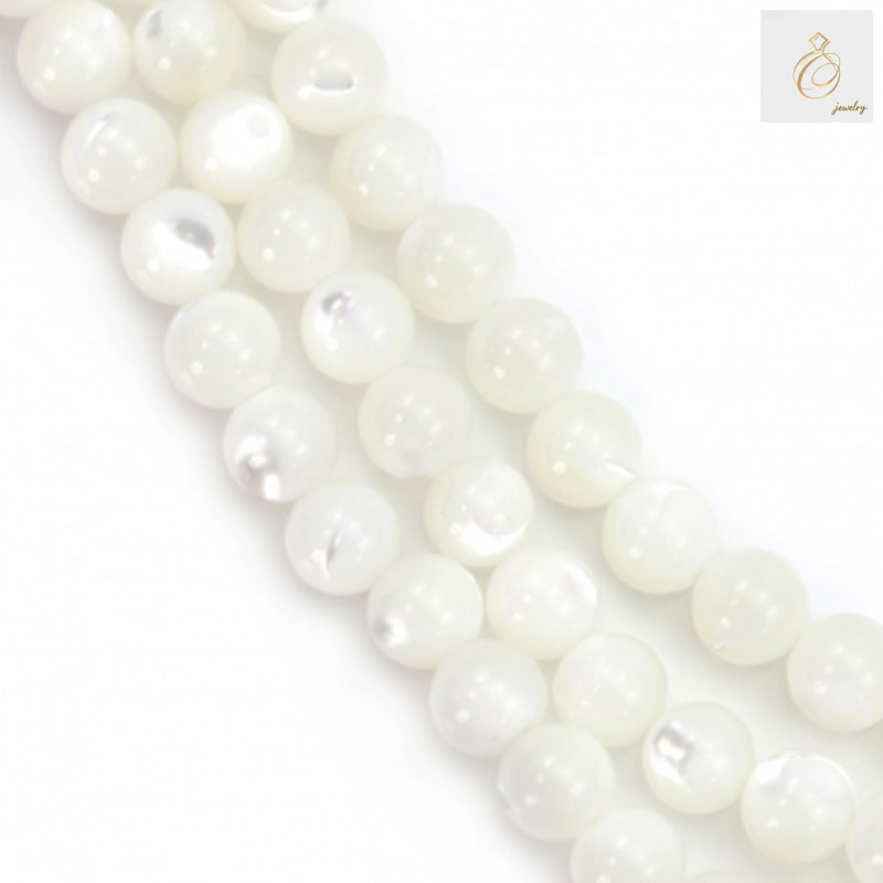 Close-up view of white mother of pearl shell round beads showing lustrous natural finish and consistent 4mm size