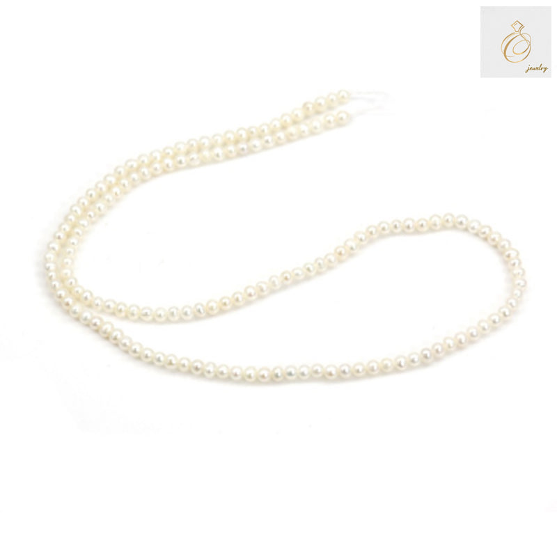 Close-up of white round cultured pearls showing natural luster and qualityWhite freshwater pearl strand on display showing size and color consistency