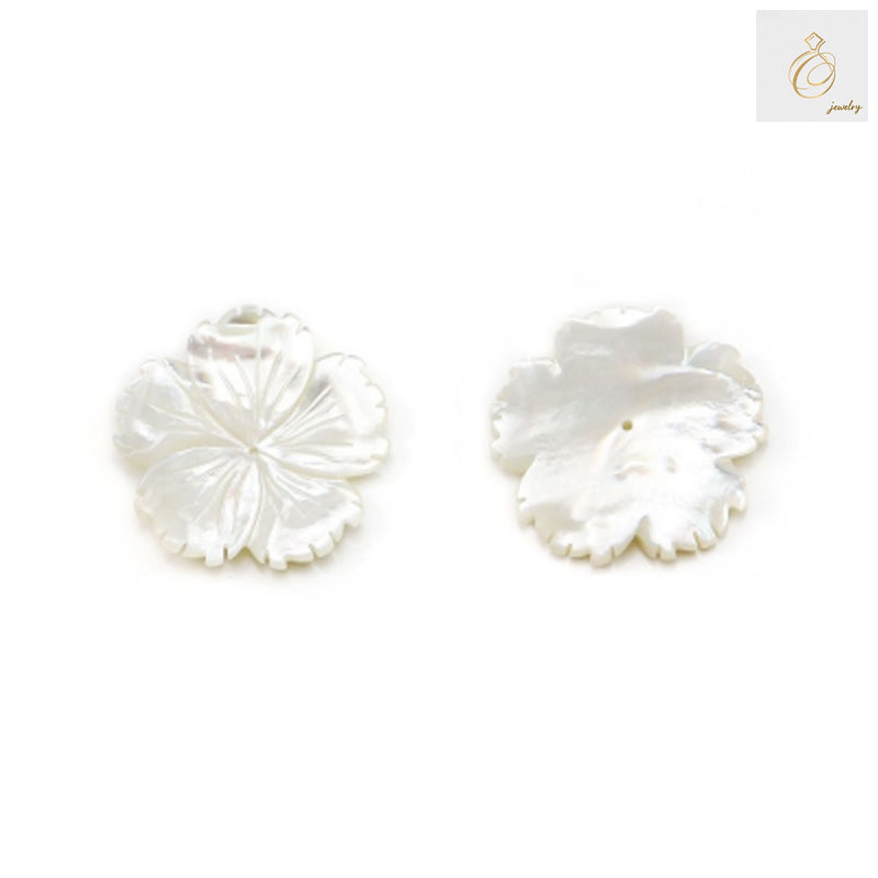 Close-up view of white mother-of-pearl flower charm showing lustrous surface and detailed petal design