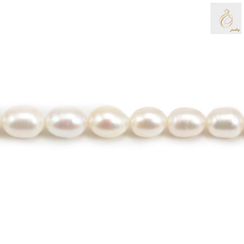 White freshwater cultured pearl strand with oval 9-10mm pearls, 39-40cm length"
"Premium white oval freshwater pearls arranged in strand for jewelry making"
"Close-up of lustrous white cultured pearls showing natural nacre and oval shape