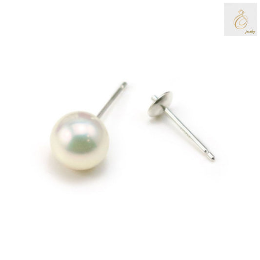 Close-up view of 925 sterling silver earring studs showing quality finish and 4mm size detail