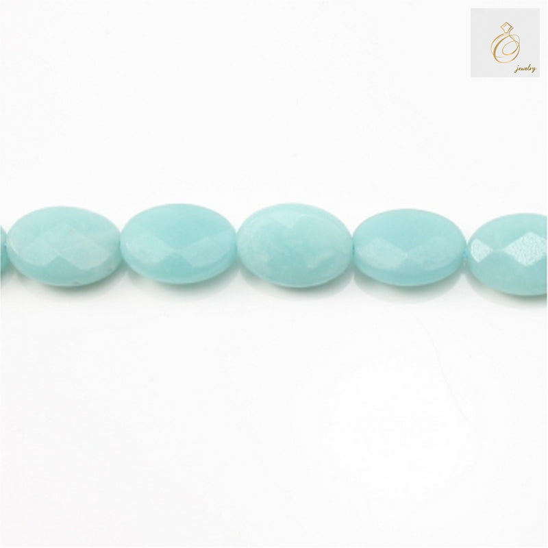 Natural amazonite faceted oval beads 8x10mm arranged on white background showing blue-green color and brilliant cut