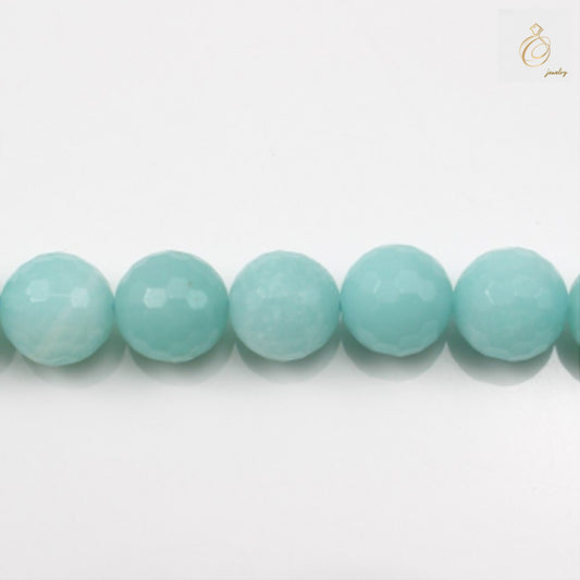 Natural amazonite faceted round beads 6mm diameter on white backgroundClose-up view of blue-green amazonite gemstone beads showing faceted surface and clarity