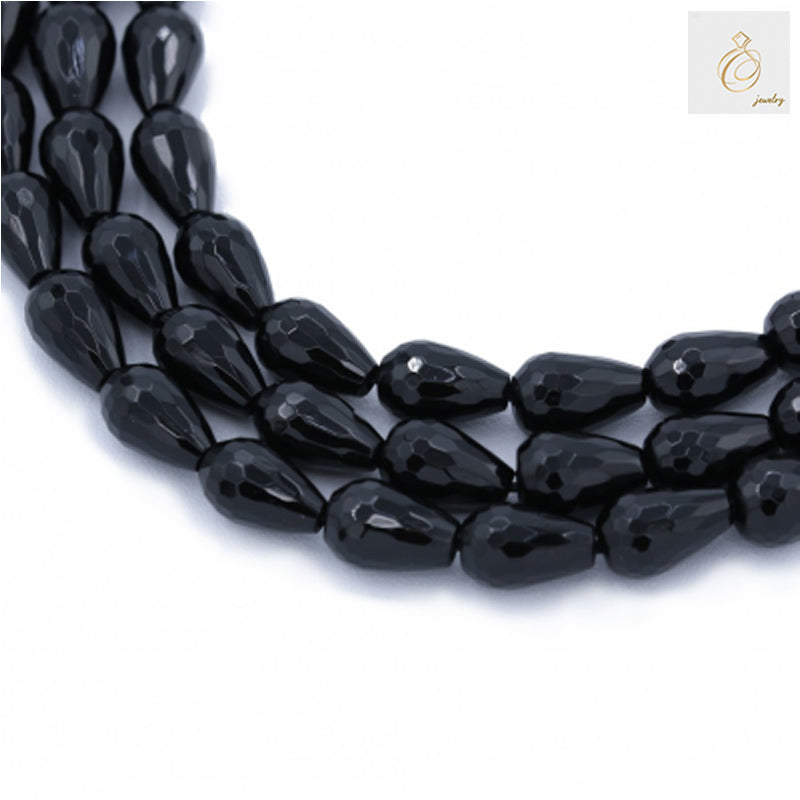Black agate faceted teardrop beads 8x12mm arranged in multiple strands showing the full 38-40cm length and glossy finish