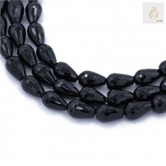 Black agate faceted teardrop beads 8x12mm arranged in multiple strands showing the full 38-40cm length and glossy finish