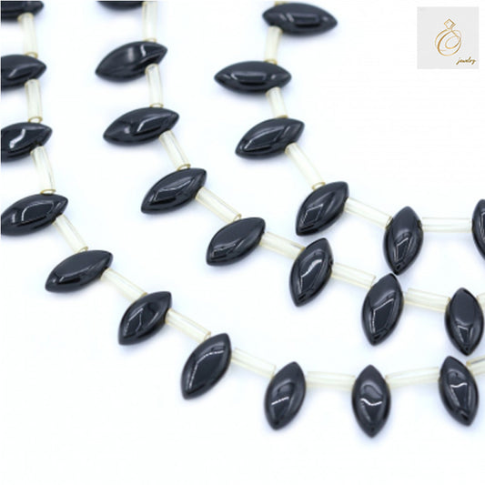 Black Agate Olive 5x10mm Gemstone Beads - Multiple strands showing oval-shaped black beads with glossy finish