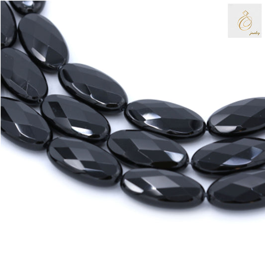 Black Agate Oval Faceted Gemstone Beads 15x30mm - Multiple strands showing faceted surface detail