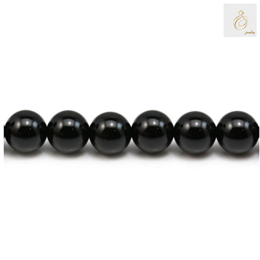 Glossy black agate round beads 8mm diameter arranged in a strand, perfect for jewelry making and craft projects