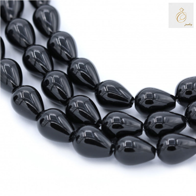 Black Agate Teardrop Gemstone Beads - Multiple strands showing 13x18mm teardrop-shaped beads