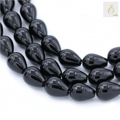 Black Agate Teardrop Gemstone Beads - Multiple strands showing 13x18mm teardrop-shaped beads