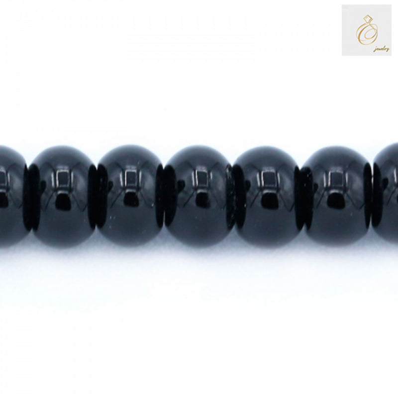 Close-up view of black agate abacus shaped beads showing texture and quality, 4x6mm gemstone beads