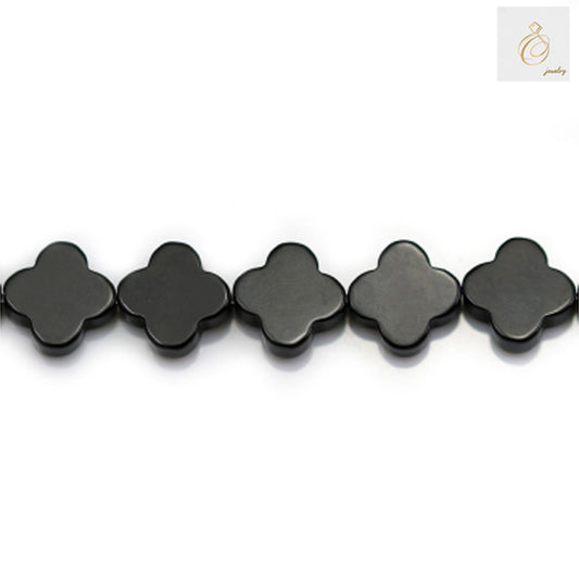 Close-up view of 10mm black agate clover beads showing natural stone texture and shine 