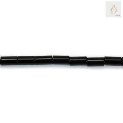 Close-up view of black agate cylinder beads showing texture and quality