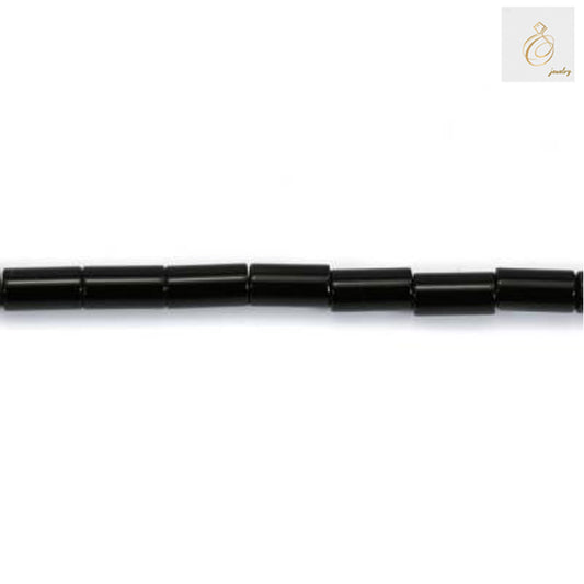 Close-up view of black agate cylinder beads showing texture and quality