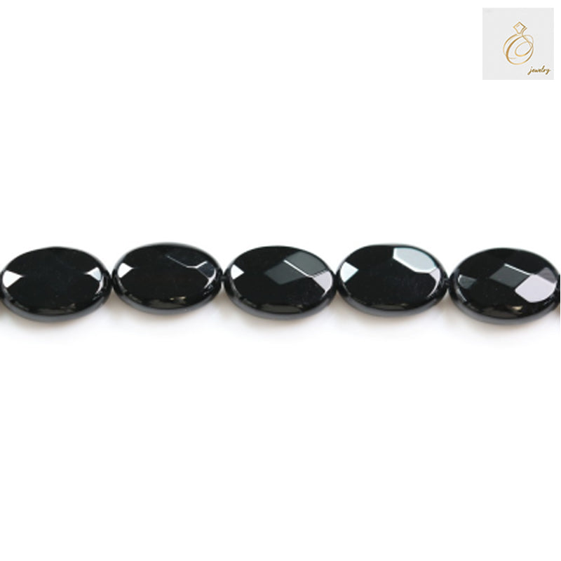 Black agate faceted oval beads 10x14mm arranged in a strand showing consistent size and quality for crafting projects