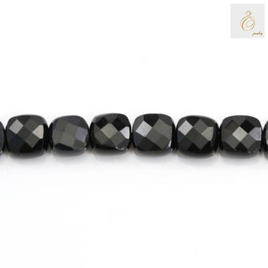 Close-up view of black agate faceted square beads 8mm in a single strand displaying the geometric cut and lustrous surface finish