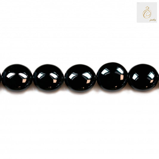 Black Agate Flat Round Gemstone Strand - 12mm beads in a row displaying high polish and uniform shape
