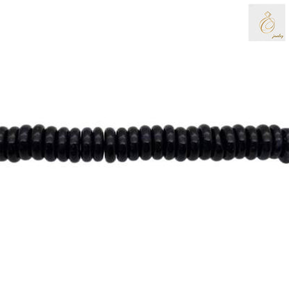 Black Agate Heishi Beads arranged in multiple strands showing texture and quality