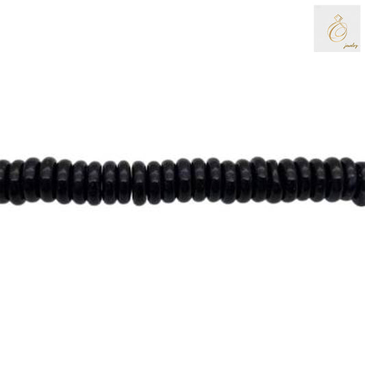 Black Agate Heishi Beads arranged in multiple strands showing texture and quality