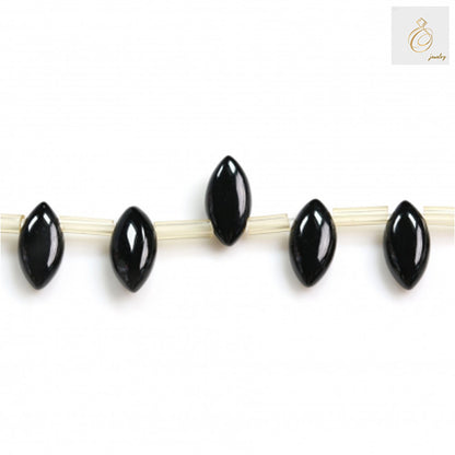 Black Agate Olive 5x10mm Gemstone Beads - Close-up view of individual oval beads on strand showing detail and quality