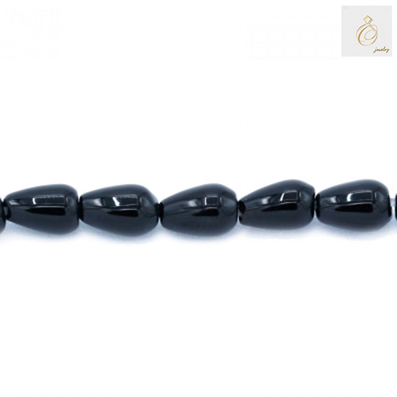 Close-up of Black Agate Teardrop beads. High-quality 4x6mm teardrops for crafting and jewelry design