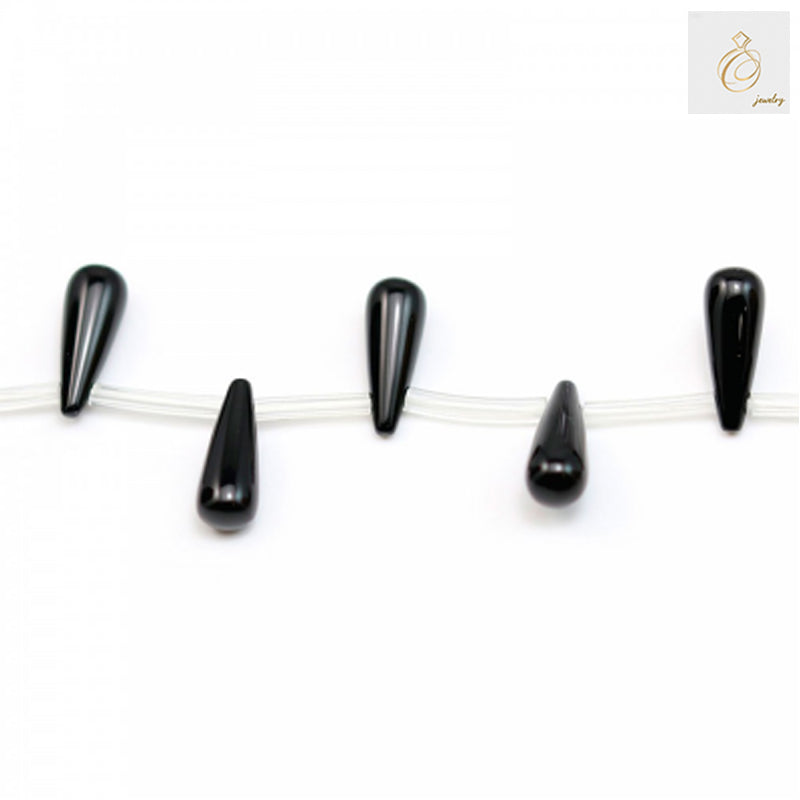Black agate teardrop beads 6x16mm strung on clear thread showing 38-40cm strand length for jewelry making